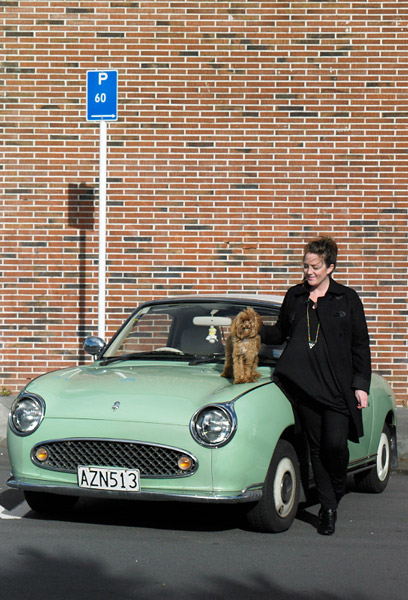 Sara Black with her 1991 Nissan Figaro and poodle papillon cross 
