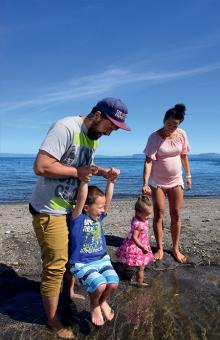 At home on the shore of Lake Taupo are Ariki Hamilton, Meriana Morehu and their children Ngaio and Bella.