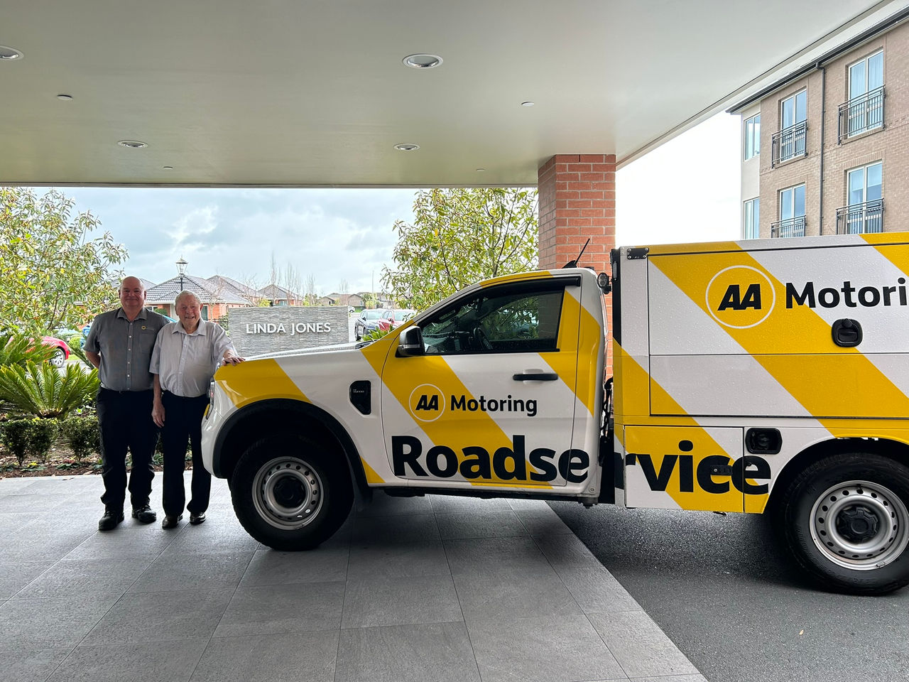 Ken and Wayne standing next to an AA Roadservice ute