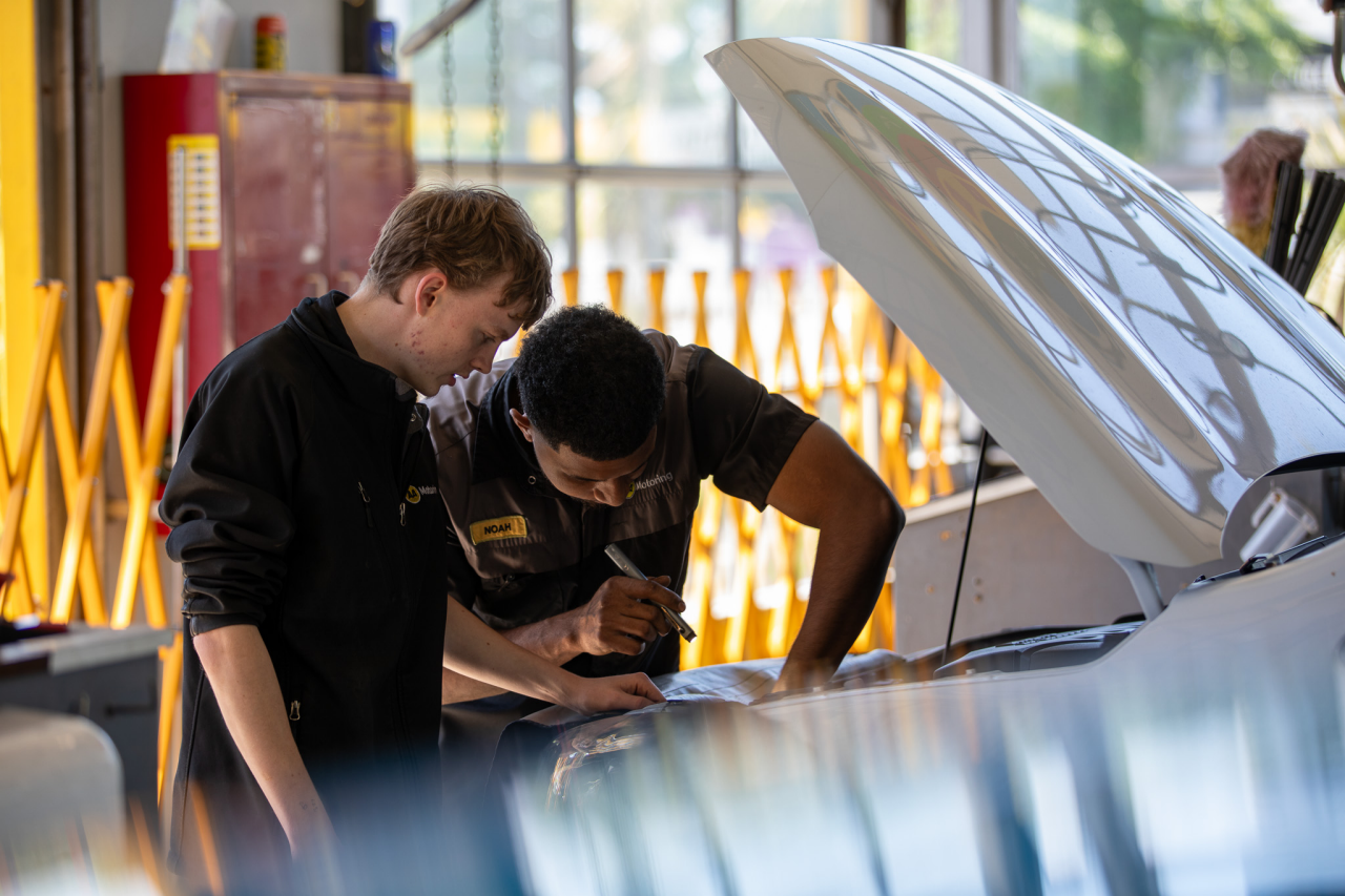 Person driving car with mobile