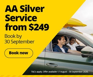 Promotional banner for an AA Silver Service offer. The left side of the image features a bright yellow geometric panel with bold black text reading “AA Silver Service from $249” and “Book by 30 September.” Below the text is a yellow “Book now” button outlined in black. The right side shows a green vehicle with two occupants visible through the side windows and yellow surfboards secured on the roof. Small white text along the bottom reads: “T&Cs apply. Offer available 17 August - 30 September 2026.” The design uses a yellow, black, green, and grey colour palette to emphasise the service promotion.