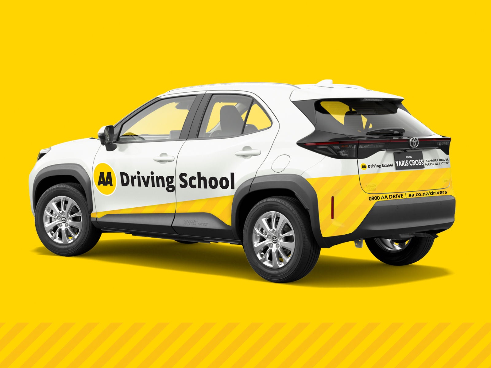 AA Driving School branded car with logo, side view. 