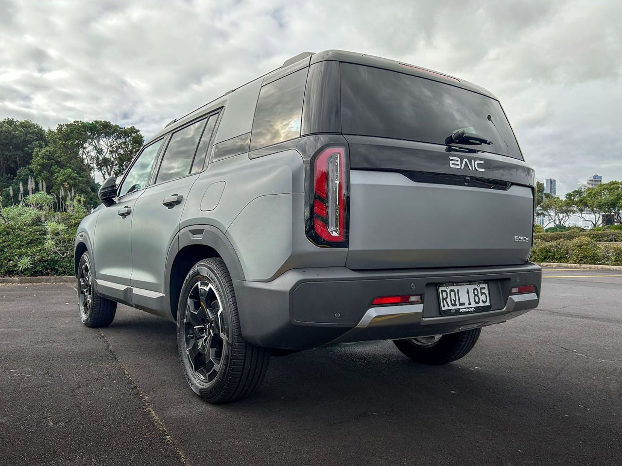 rear quarter view of grey SUV