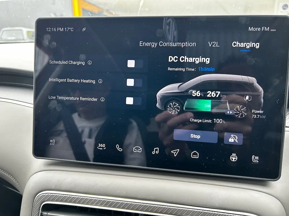 Vehicle infotainment touchscreen displaying the EV charging screen.