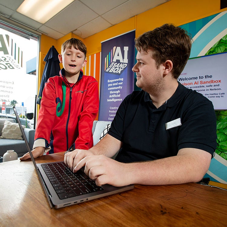Jack Manson teaches people at the AI Sandbox. Photo by Tim Cuff.