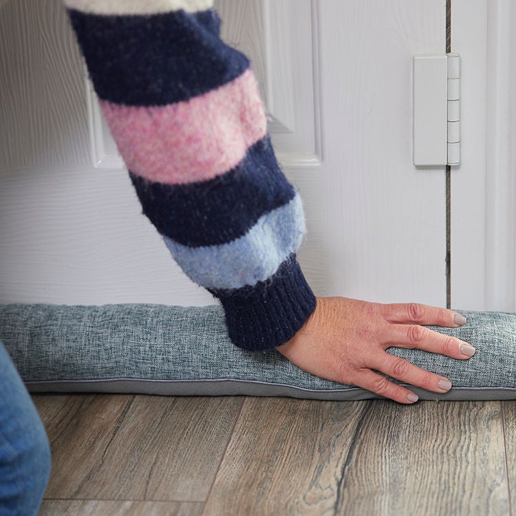 Use draft stoppers to help keep your home warm this winter.
