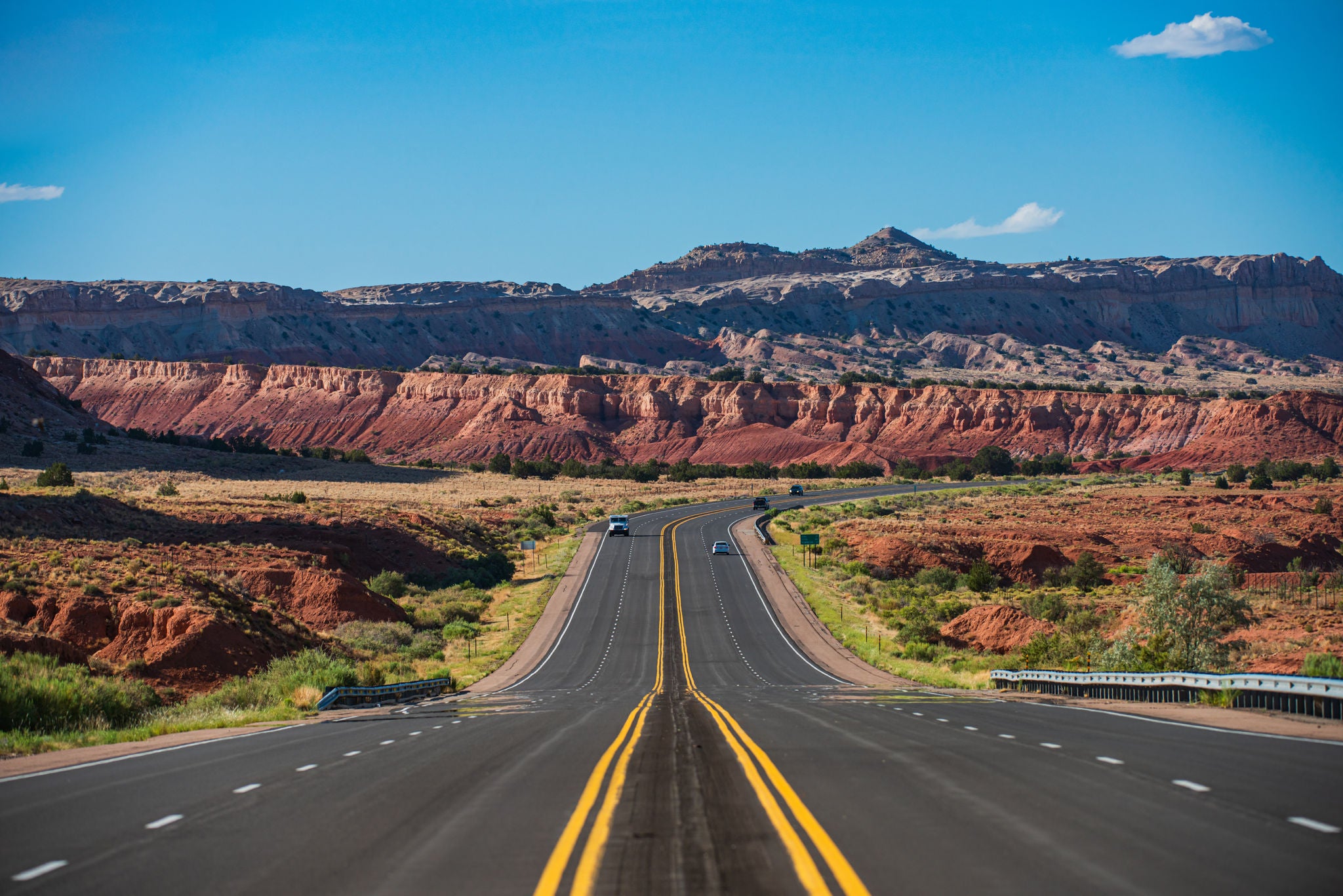 Highway road. Asphalt highways and mountains under the blue sky