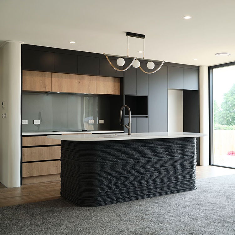 The kitchen island in the show home shows the 3D printed structure. Photo by Mark Smith.