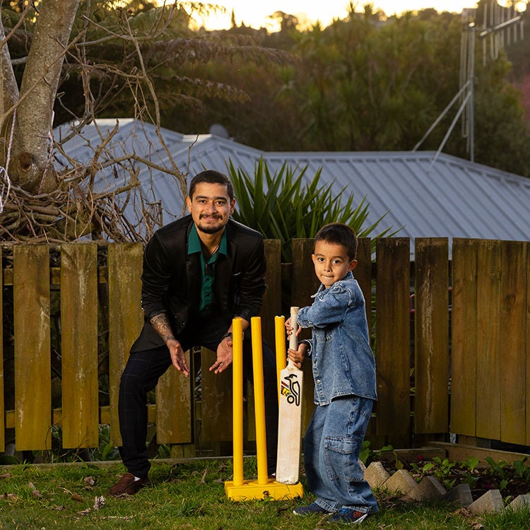Madan and son Riyan playing backyard cricket. Photo by Alan Gibson.