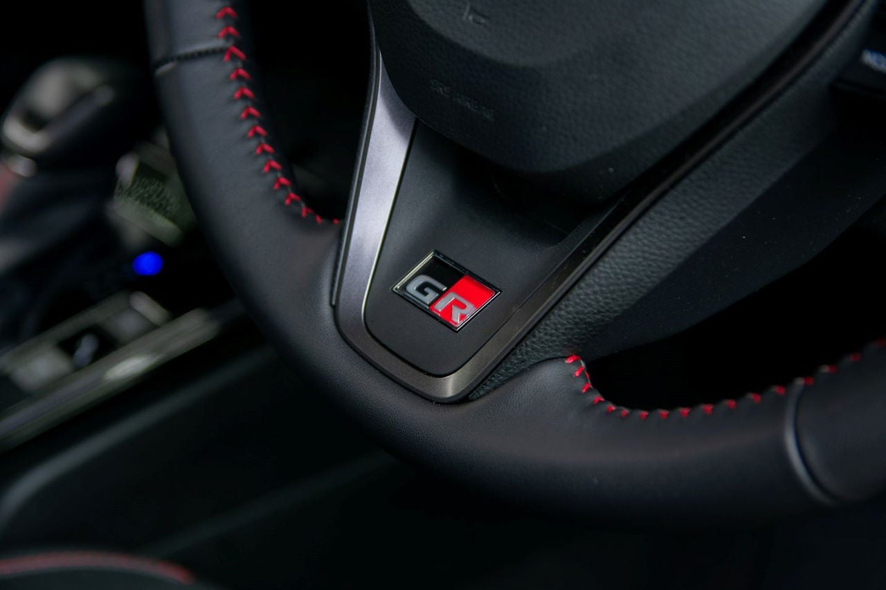 close up view of steering wheel showing GR badge