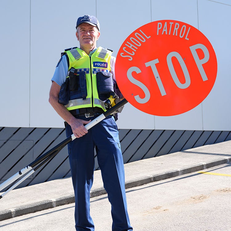 Senior Constable Gordon Campbell's job involves training kids to be school patrollers.