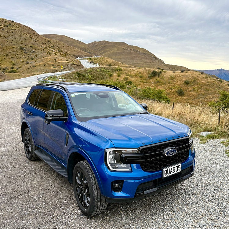 A Thrifty Rental car on the Crown Range.
