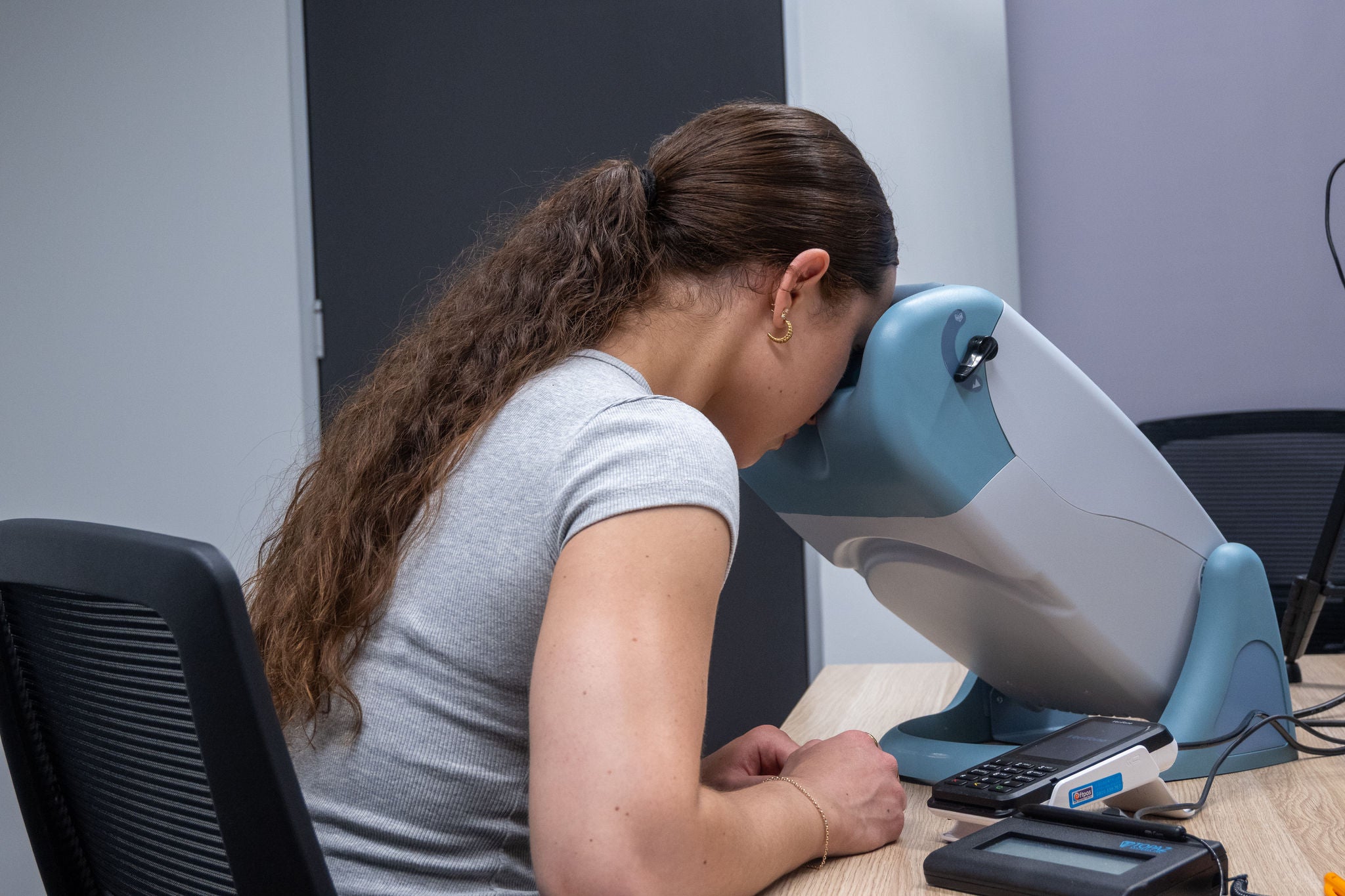 young woman taking a sight test
