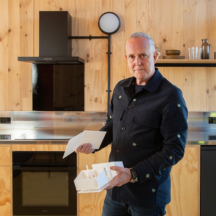 Architect Richard Naish with a model of the Living House. Photo by Alan Gibson.
