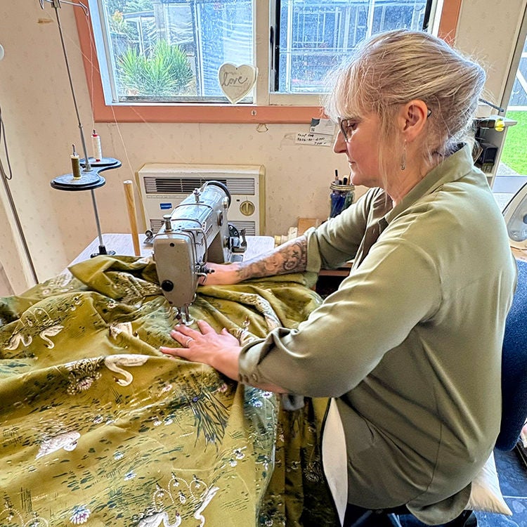 Anita Carter works on an eiderdown in a beautiful Bianca Lorenne fabric. Photo by Jo Percival.