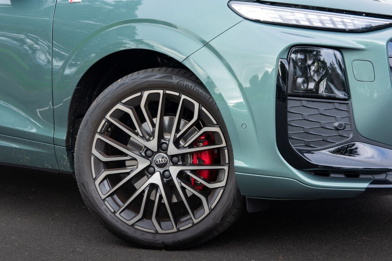 close up view of front wheel and headlamps