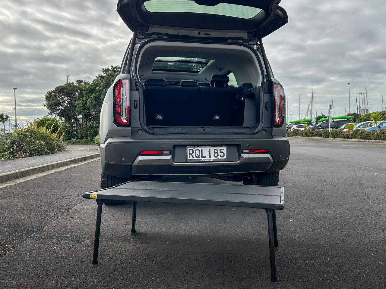 view of boot with door open and fold-up picnic table set up
