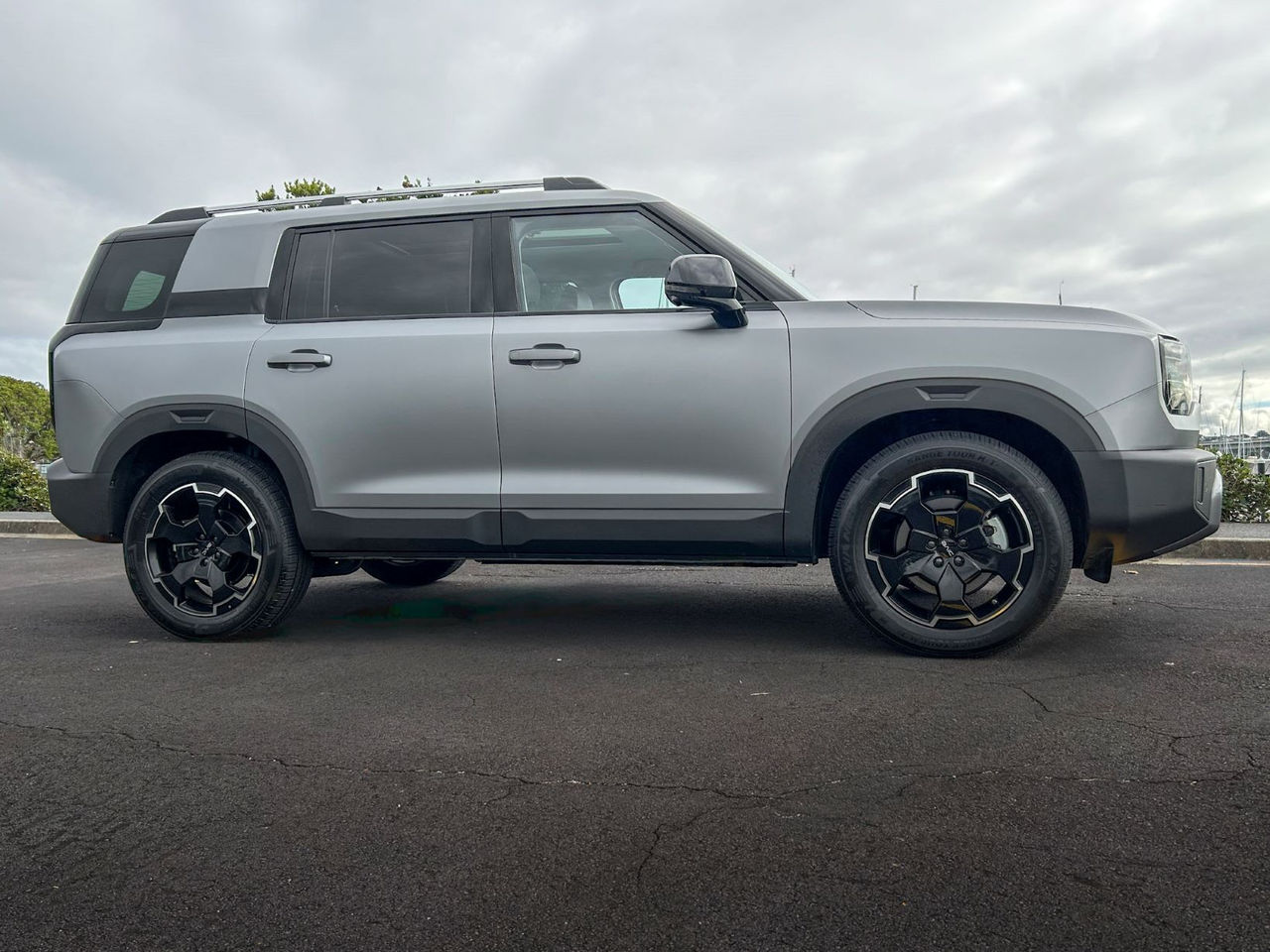 side on view of grey SUV