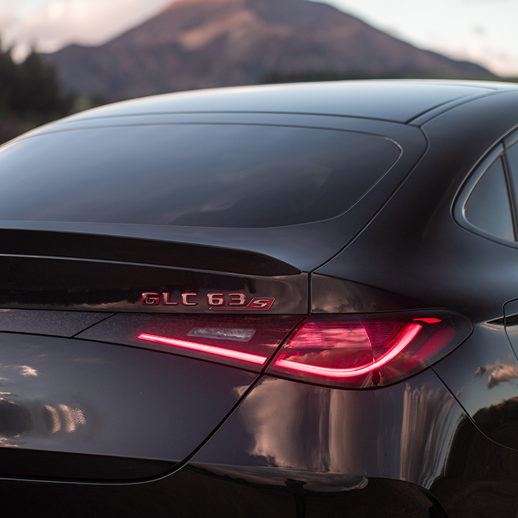 The Mercedes-AMG is a coupe in the French sense, with its sloping rear roofline.