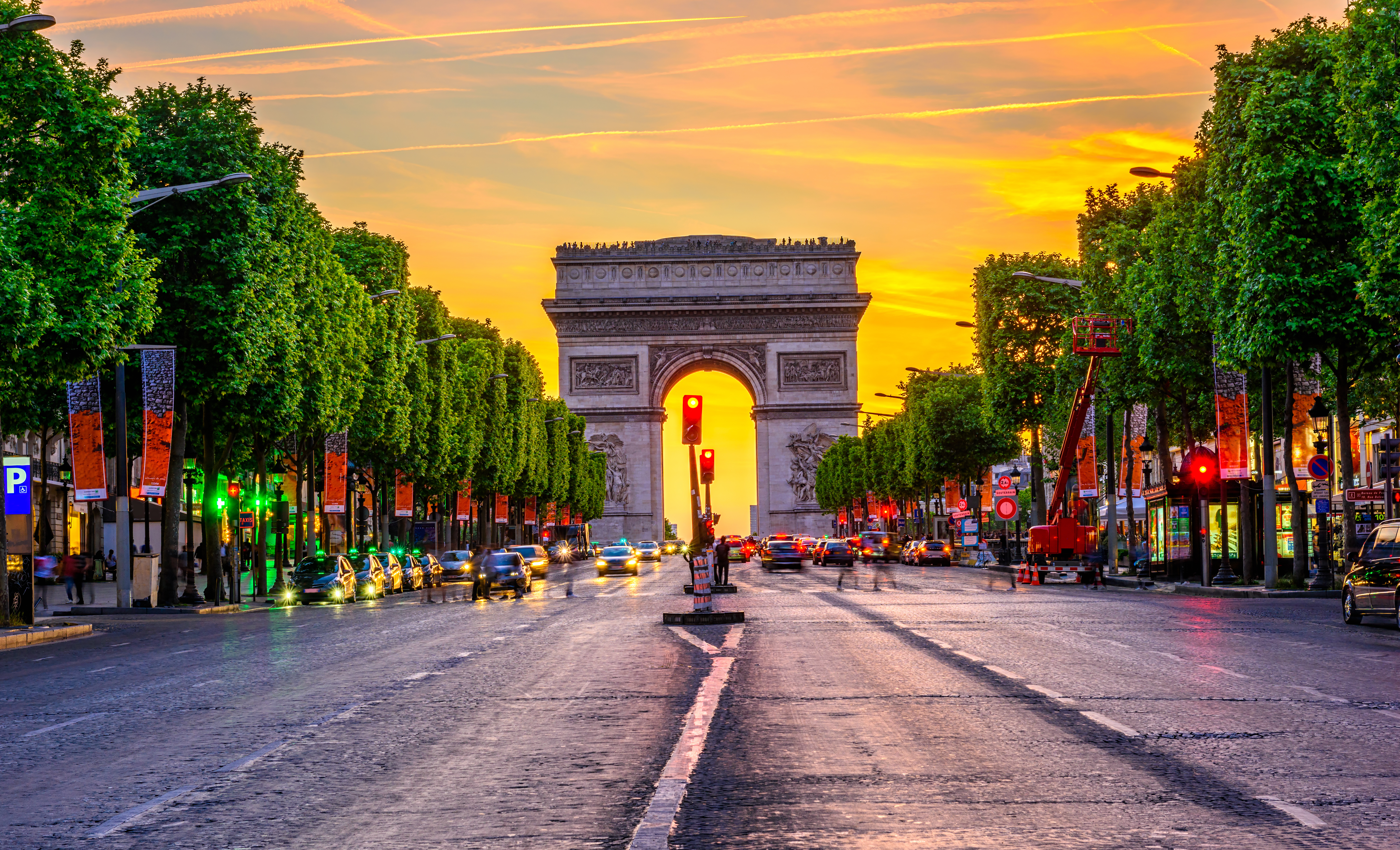 Street avenue with Arc de Triomphe in the centre frame