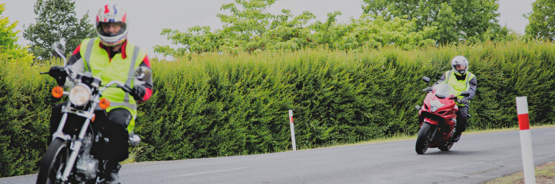 Two men riding motorcycle