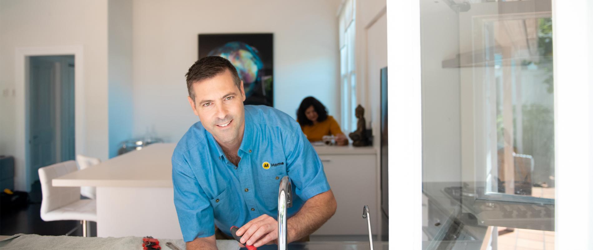 AA Home tradesperson smiling at the camera