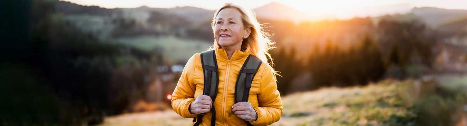 Woman on a hillside in hiking gear