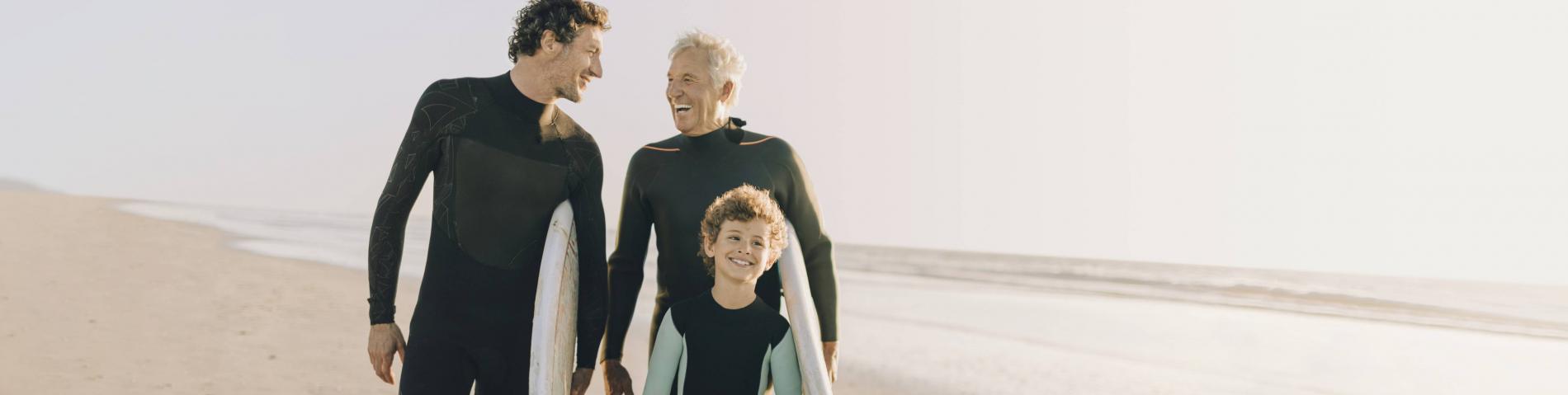 A grandfather, son, and grandson photo at the beach