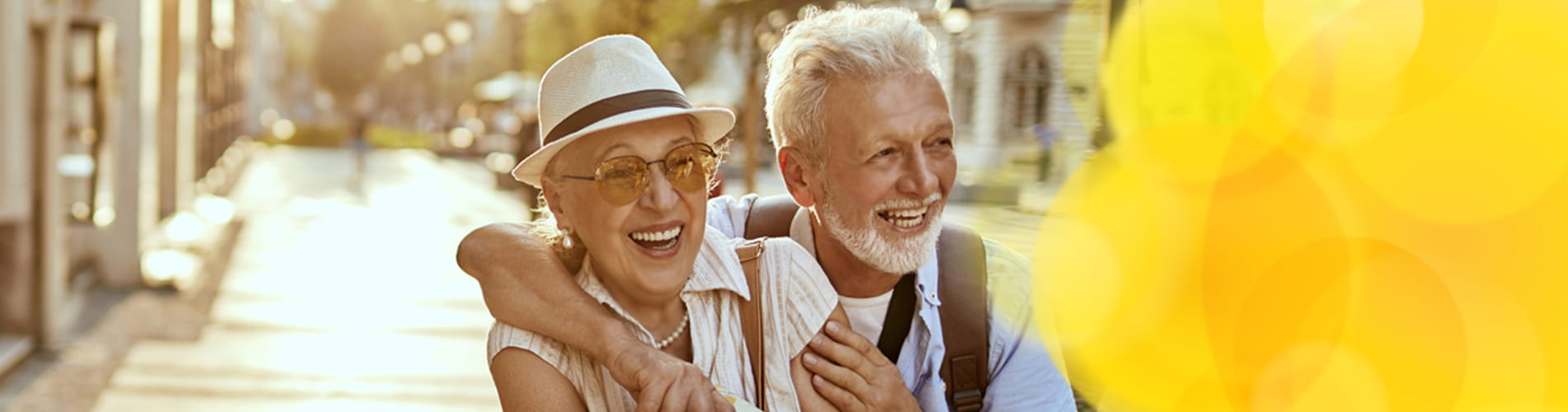 Couple laughing and enjoying a walk through a European city
