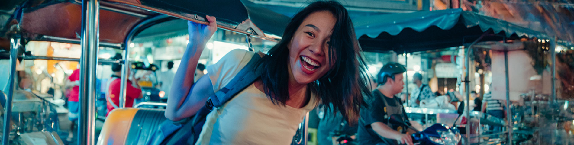 Young woman in South East Asia on a tuktuk