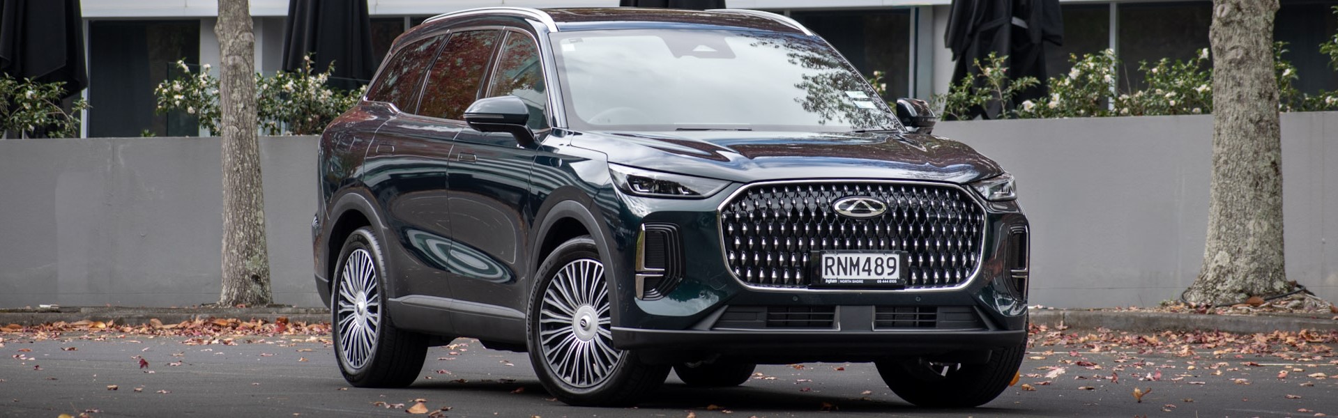 Front quarter view of dark green SUV