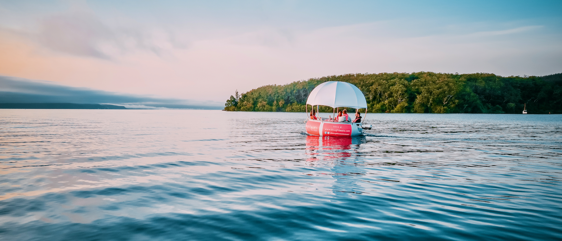 Helm your own Doughboat on Lake Taupō
