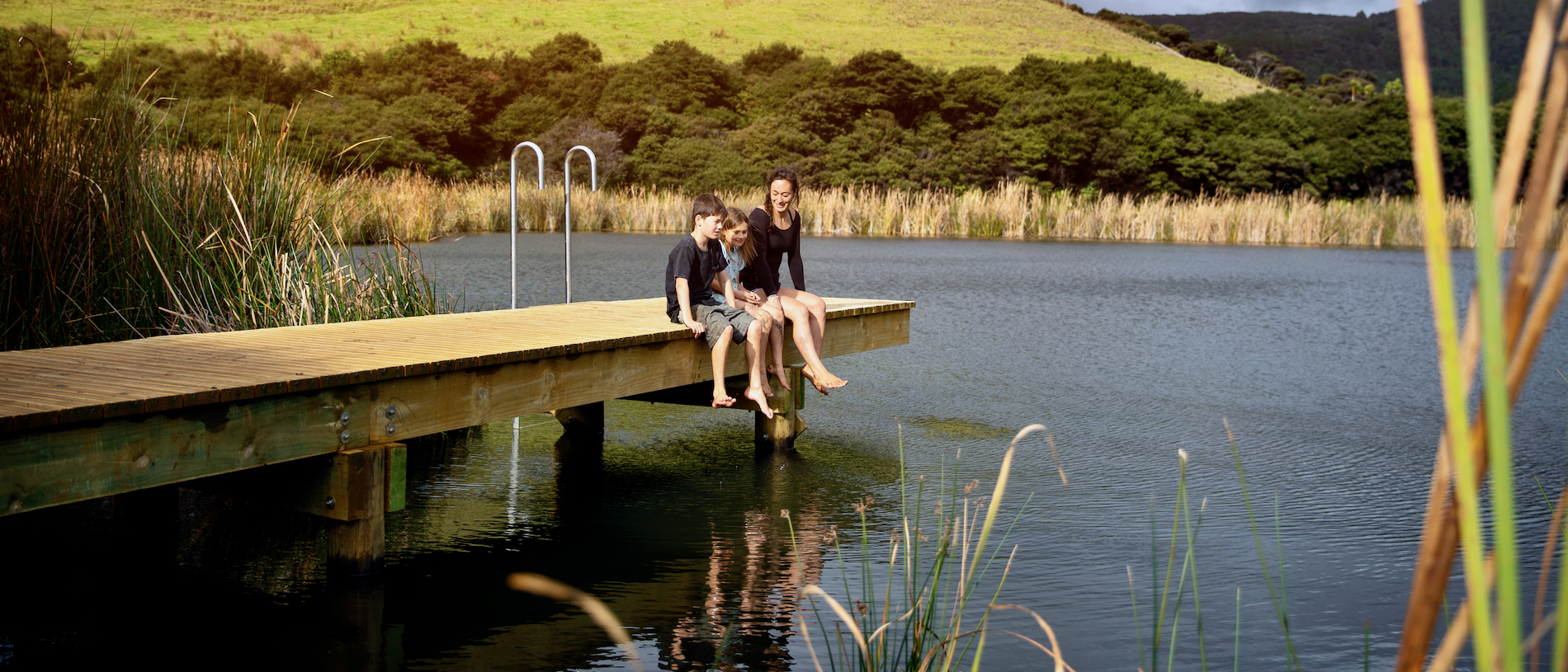 Climb the soaring sand dunes at Lake Wainamu