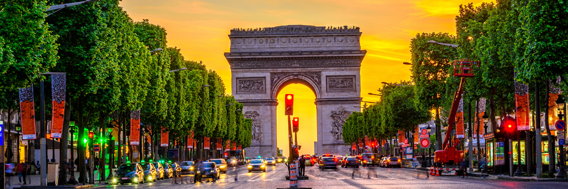 Street avenue with Arc de Triomphe in the centre frame