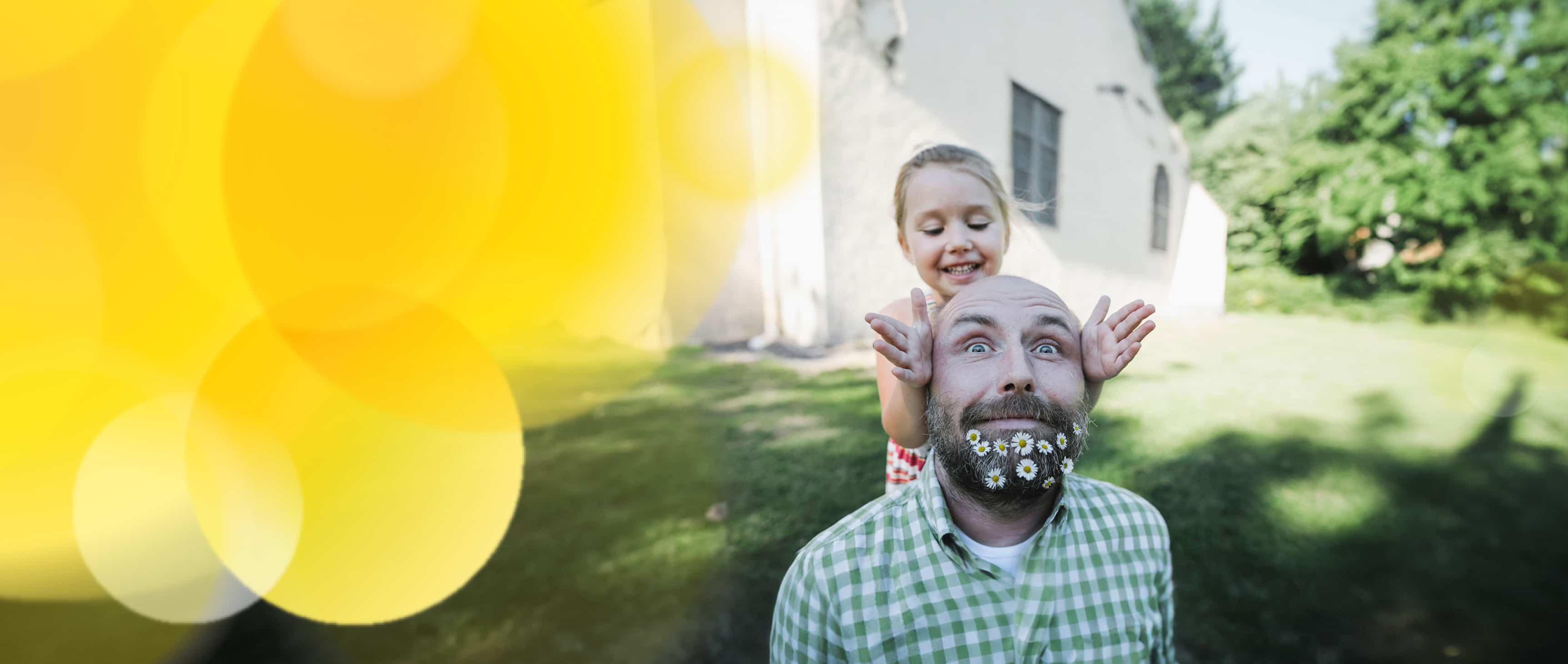Father and daughter playing in backyard