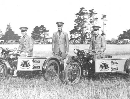 Black and white historical image of the AA patrol service on vintage motorcycles