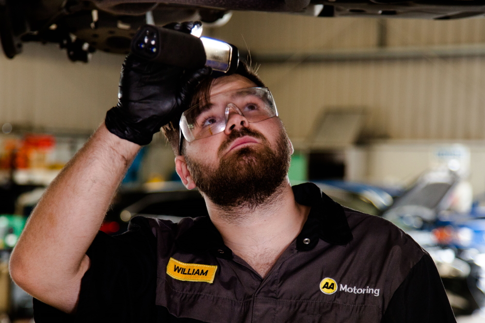 Mechanic under car