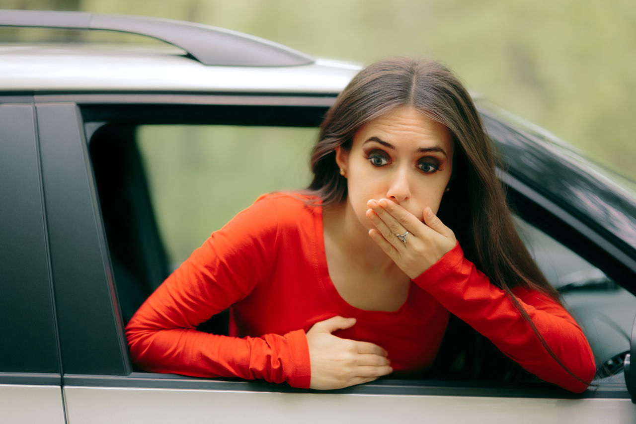 Woman sick covering her mouth