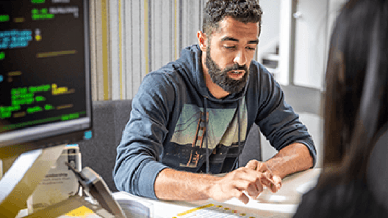 An AA Insurance consultant talking to a customer