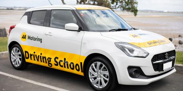 A parked AA Driving School car