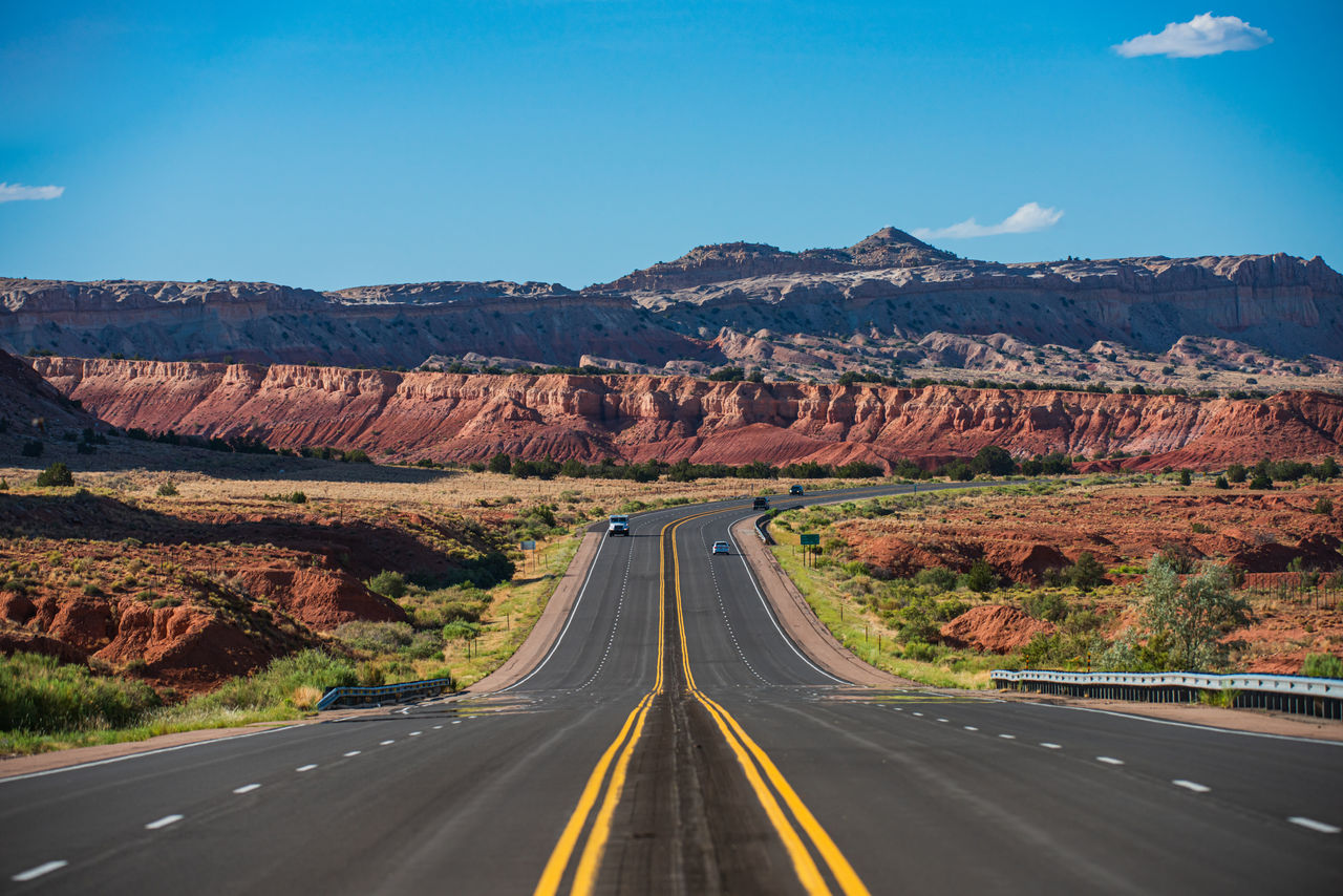 Highway road. Asphalt highways and mountains under the blue sky