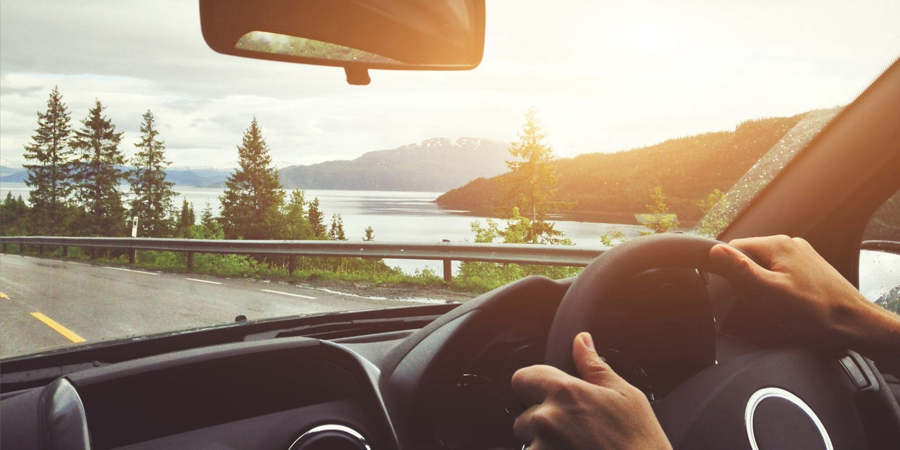 Close up image of someone driving