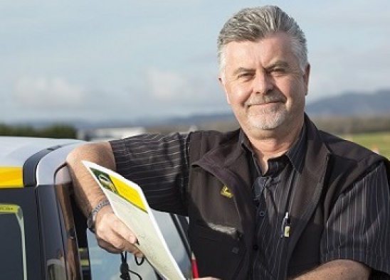 AA Driver training instructor leaning on AA Driving school car