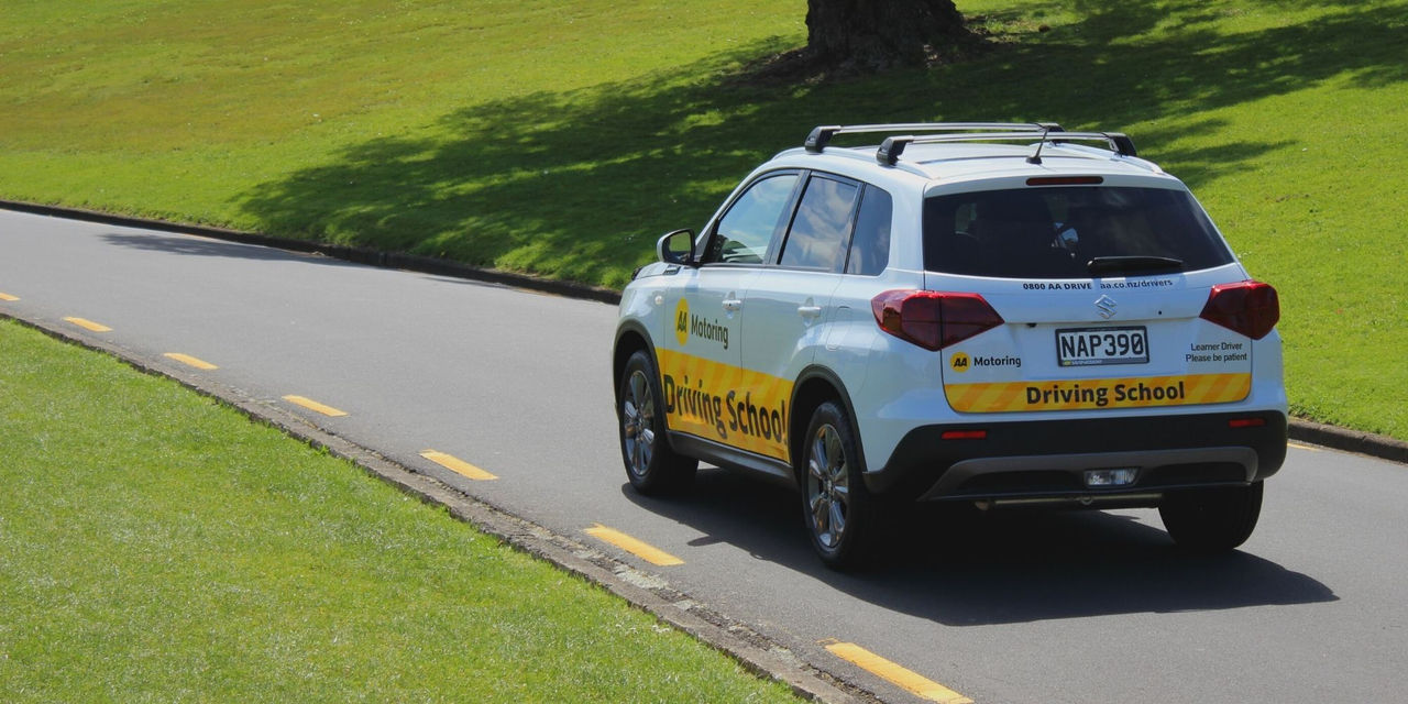 An AA Motoring Driving School car on the road
