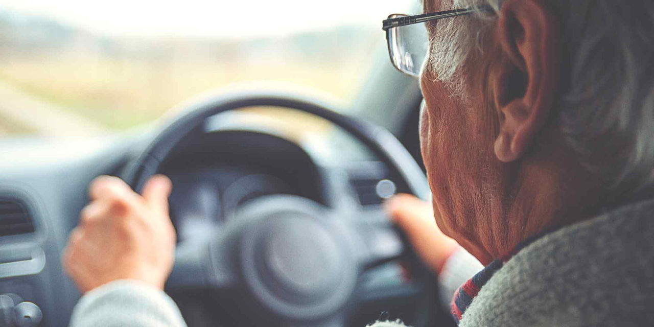 Old man driving car