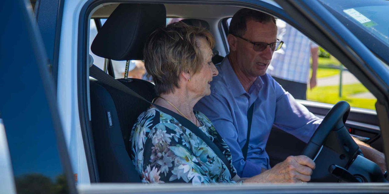 Elderly women doing her on-road safety test