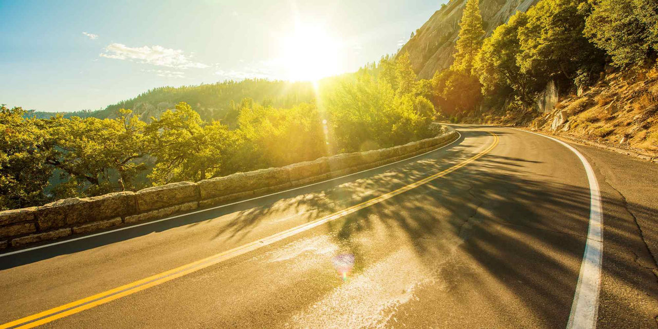 Sun shining on rural road