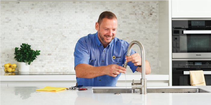 Plumber repairing a tap