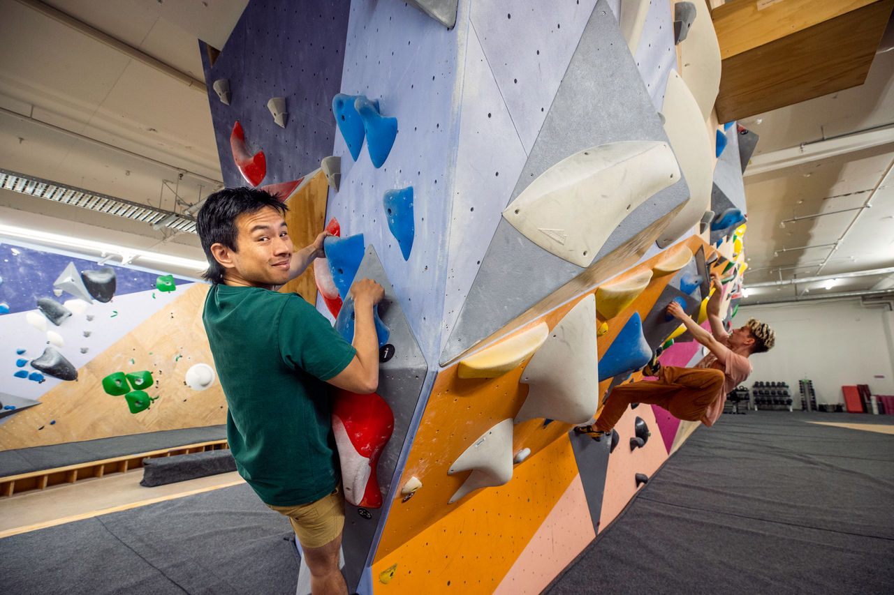 Communications Advisor, Matt Tso trying out faultline which is a bouldering gym