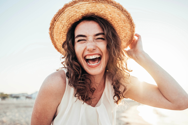 Girl smiling at the beach